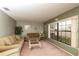 Comfortable living room featuring a large window and plush seating at 7794 Indian Ridge S Trl, Kissimmee, FL 34747