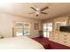This primary bedroom offers ample natural light and access to a pool and patio area at 7794 Indian Ridge S Trl, Kissimmee, FL 34747