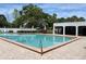 A beautiful community pool with ample seating and a shaded cabana at 7794 Indian Ridge S Trl, Kissimmee, FL 34747
