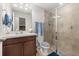 Bathroom featuring a glass-enclosed shower with tile surround, toilet, and vanity at 840 Luarca Ln, Oviedo, FL 32765