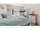 Light-filled bedroom with blue accents and TV; attached bathroom at 840 Luarca Ln, Oviedo, FL 32765