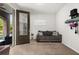 Neutral colored room with carpeting and a door to the outside as well as a grey couch at 840 Luarca Ln, Oviedo, FL 32765