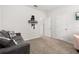 Neutral colored room with carpeting and a grey couch at 840 Luarca Ln, Oviedo, FL 32765