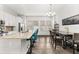 Spacious kitchen with stainless steel appliances, a large center island, and modern lighting fixtures at 840 Luarca Ln, Oviedo, FL 32765