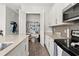 Well-organized kitchen with stainless steel appliances, stone countertops, and a walk-in pantry at 840 Luarca Ln, Oviedo, FL 32765
