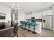 Open concept kitchen features stainless appliances, a dining area, and ample cabinet space at 840 Luarca Ln, Oviedo, FL 32765