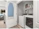 Convenient laundry room with washer and dryer, plus additional storage space at 840 Luarca Ln, Oviedo, FL 32765