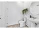 Well-lit half bath with modern fixtures and decorative wall art at 8968 Amelia Downs Trl, Kissimmee, FL 34747