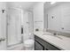 Bathroom with a glass-enclosed shower, modern vanity, and neutral color scheme at 8968 Amelia Downs Trl, Kissimmee, FL 34747
