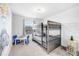 bedroom featuring bunk beds, playful decor, and a cheerful atmosphere at 8968 Amelia Downs Trl, Kissimmee, FL 34747