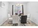 Bright dining room featuring modern decor and large window providing ample natural light at 8968 Amelia Downs Trl, Kissimmee, FL 34747