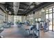 Modern community gym with various exercise equipment and natural light at 8968 Amelia Downs Trl, Kissimmee, FL 34747