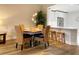 Cozy dining area featuring stylish light fixtures, an adjacent kitchen, and seating for four at 910 Spring Park St # 103, Celebration, FL 34747