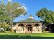 Charming Heritage Hall building with inviting entrance, lush lawn and mature landscaping at 910 Spring Park St # 103, Celebration, FL 34747