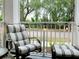 Relax on this cozy front porch with comfortable seating and a serene neighborhood view at 910 Spring Park St # 103, Celebration, FL 34747