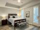 Serene main bedroom featuring trey ceilings, wood floors, and plantation shutters for a calming retreat at 910 Spring Park St # 103, Celebration, FL 34747