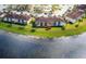 Aerial view of condo next to lake, showcasing the community's proximity to the water at 13840 Timberbrooke Dr # 103, Orlando, FL 32824