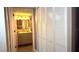 Bathroom with a modern vanity featuring brushed brass fixtures, and bifold doors at 13840 Timberbrooke Dr # 103, Orlando, FL 32824