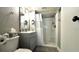 Bathroom featuring a modern vanity, commode and a walk-in shower with a shower curtain at 13840 Timberbrooke Dr # 103, Orlando, FL 32824