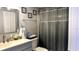 Cozy bathroom with modern fixtures including a framed mirror, toilet, and vanity at 13840 Timberbrooke Dr # 103, Orlando, FL 32824