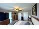 Spacious bedroom featuring a ceiling fan, neutral walls, and plentiful closet space at 13840 Timberbrooke Dr # 103, Orlando, FL 32824