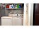 Convenient laundry closet with side-by-side washer and dryer at 13840 Timberbrooke Dr # 103, Orlando, FL 32824