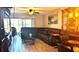 Cozy living room with sectional sofa, decorative accents, and sliding glass door to patio at 13840 Timberbrooke Dr # 103, Orlando, FL 32824