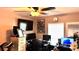 Practical home office setup with multiple monitors, treadmill and clock at 13840 Timberbrooke Dr # 103, Orlando, FL 32824