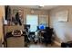 Functional home office with multiple monitors and ample workspace at 13840 Timberbrooke Dr # 103, Orlando, FL 32824