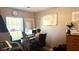 Comfortable home office bathed in sunlight from the windows at 13840 Timberbrooke Dr # 103, Orlando, FL 32824