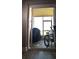 Screened-in patio featuring bike, grill, and sliding glass doors to the interior at 13840 Timberbrooke Dr # 103, Orlando, FL 32824