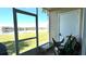 Covered patio with a scenic lake view, perfect for outdoor relaxation at 13840 Timberbrooke Dr # 103, Orlando, FL 32824