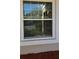 White framed window with blinds offering natural light and exterior view at 13840 Timberbrooke Dr # 103, Orlando, FL 32824