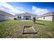 Spacious backyard with a small patio area and a garden plot ready for customization at 1061 Citrus Landings Blvd, Davenport, FL 33837