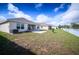 Spacious backyard with a privacy fence and an open lawn at 1061 Citrus Landings Blvd, Davenport, FL 33837