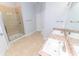 Bright bathroom featuring a glass shower, tile floors, and a vanity with dual sinks at 1061 Citrus Landings Blvd, Davenport, FL 33837
