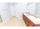 Bright bathroom featuring a tile floor, double vanity, and a large mirror at 1061 Citrus Landings Blvd, Davenport, FL 33837