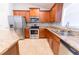 Well-equipped kitchen boasts stainless steel appliances, granite countertops, and wood cabinetry at 1061 Citrus Landings Blvd, Davenport, FL 33837