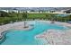 Community pool with fountain, sundeck, lounge seating, and lush landscaping at 1061 Citrus Landings Blvd, Davenport, FL 33837