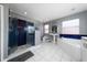 Large bathroom with a walk-in shower, tub, and single sink vanity at 10937 Prairie Hawk Dr, Orlando, FL 32837
