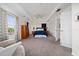 Large primary bedroom with a ceiling fan and carpet, with plenty of natural light at 10937 Prairie Hawk Dr, Orlando, FL 32837