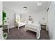 Bright bedroom featuring two twin beds, a window with natural light, and a dresser at 10937 Prairie Hawk Dr, Orlando, FL 32837