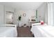 Well lit bedroom with hardwood floors featuring two twin beds and neutral decor at 10937 Prairie Hawk Dr, Orlando, FL 32837