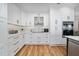 Modern kitchen featuring stainless steel appliances, lots of cabinets, and a beautiful backsplash at 10937 Prairie Hawk Dr, Orlando, FL 32837