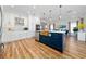 Modern kitchen with a center island, stainless steel appliances, and ample cabinet space at 10937 Prairie Hawk Dr, Orlando, FL 32837