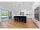 Modern kitchen with a center island, stainless steel appliances, and ample cabinet space at 10937 Prairie Hawk Dr, Orlando, FL 32837