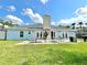 Large backyard featuring a stone chimney and patio area, great for entertaining at 12450 Greco Dr, Orlando, FL 32824