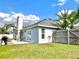 Picture of backyard with patio area and lush green lawn at 12450 Greco Dr, Orlando, FL 32824