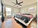 Bedroom with wood floors, ceiling fan and bright natural light at 12450 Greco Dr, Orlando, FL 32824
