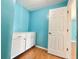 Walk-in closet with custom cabinets, shelving and bright blue walls at 12450 Greco Dr, Orlando, FL 32824